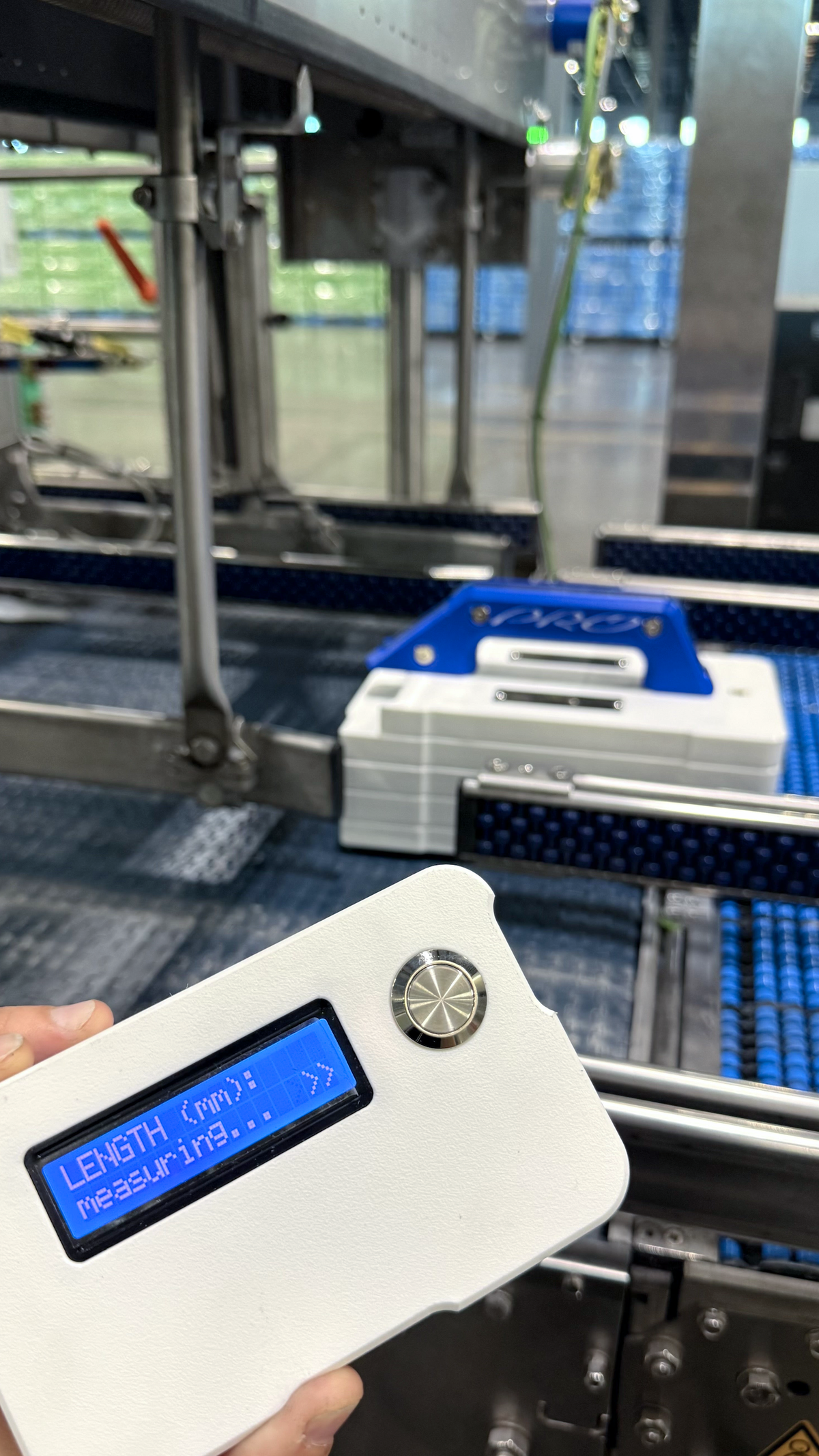 Caliveyor PRO and its remote in a factory
